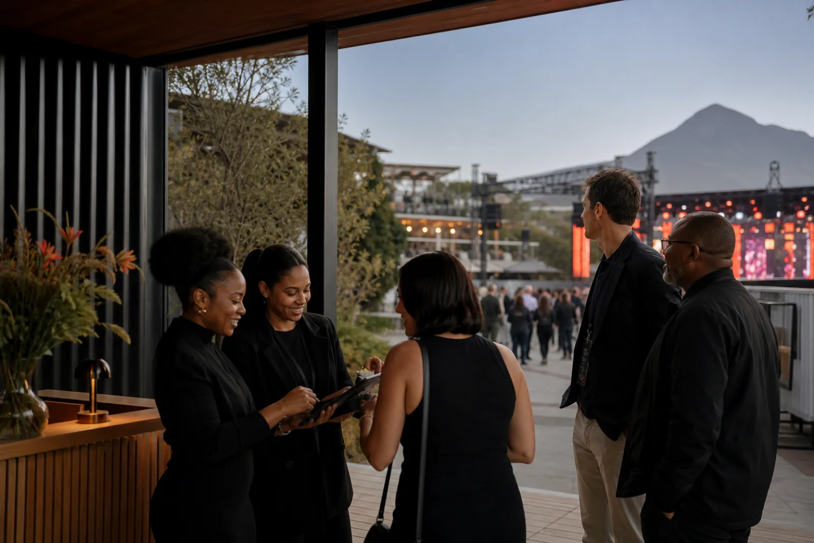 Guest relations team managing sponsor hospitality check-in at a live event